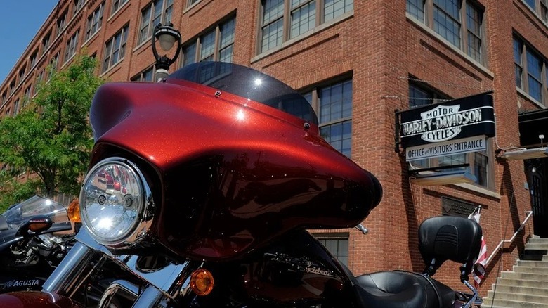 Red mptorcyle parked in front of Harley-Davidson headquarters