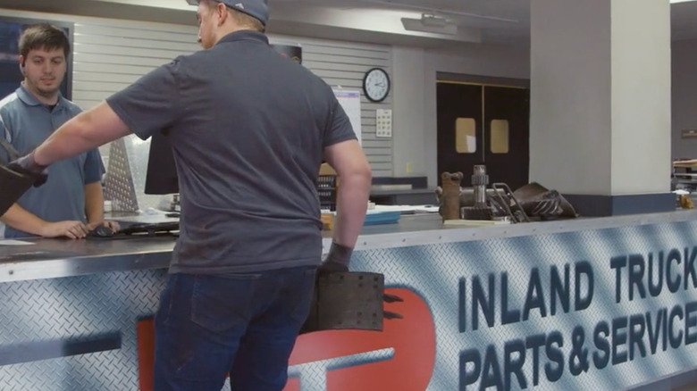 Man buying parts at Inland Truck Parts counter