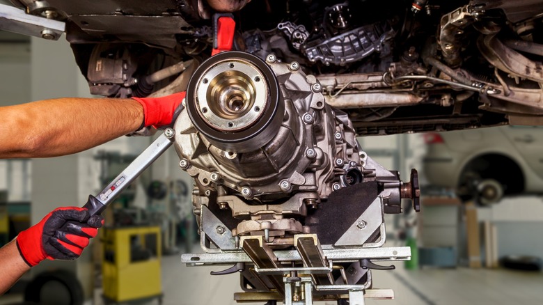 A detached transmission gearbox under a car
