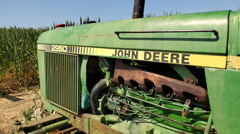 side shot of the engine compartment of a vintage John Deere tractor