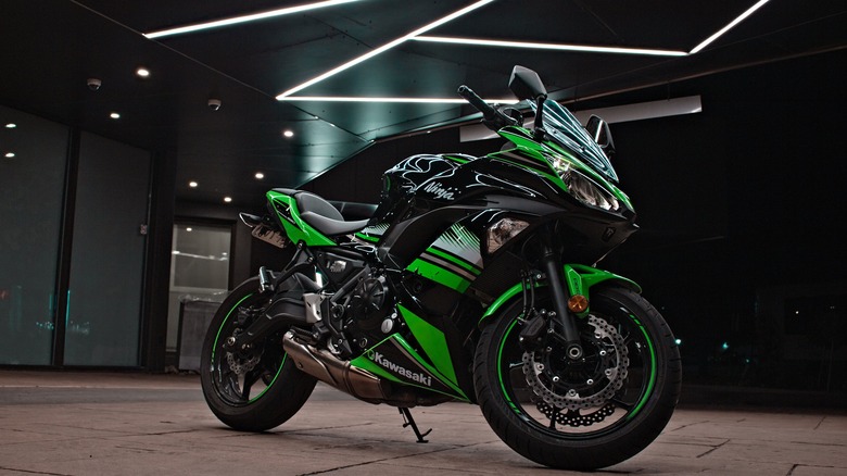 A Kawasaki Ninja motorcycle on display in a showroom
