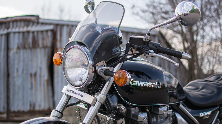 A close-up shot of the front of a black Kawasaki ZR 1100 Zephyr A1 bike on a gloomy day