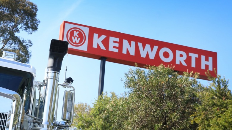 Kenworth signage with truck in the corner