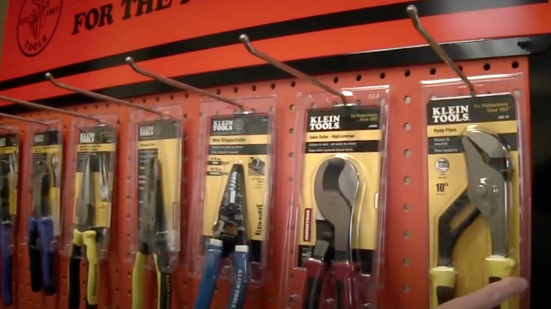 Klein tools hanging on pegs in hardware store