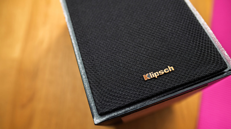 A close-up of a Klipsch speaker showcasing its sleek black front panel with the Klipsch logo