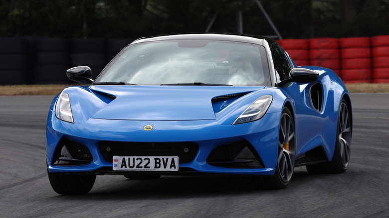 Front left view of blue Lotus Emira on track