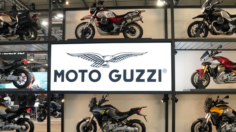 Multiple Moto Guzzi motorcycles at a Moto Guzzi exhibiton stand