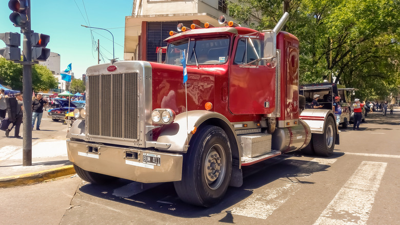 Peterbilt 379 heavy duty cargo truck in the street.