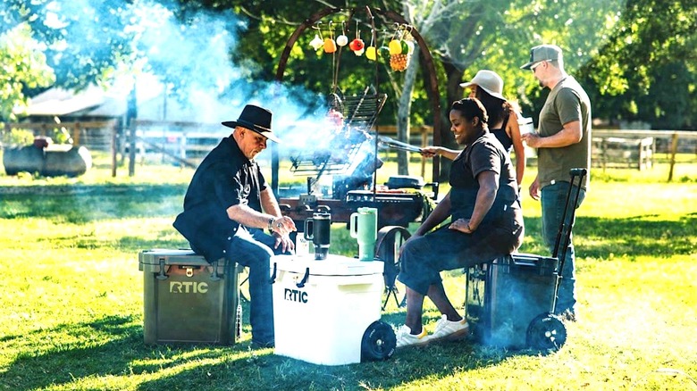 People sitting on RTIC coolers
