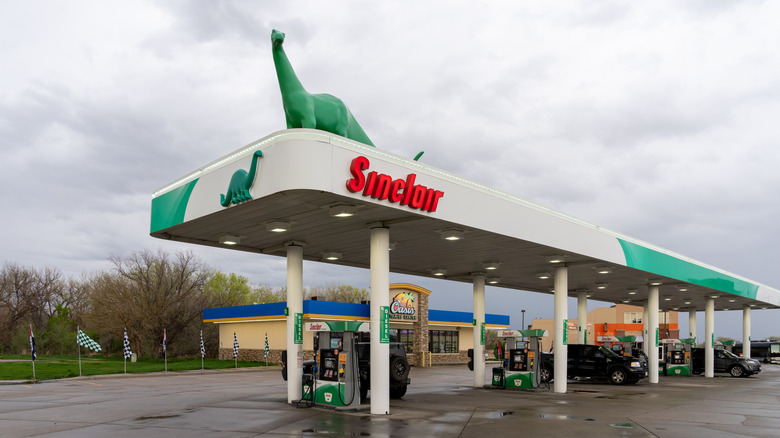 sinclair gas station with DINO on top
