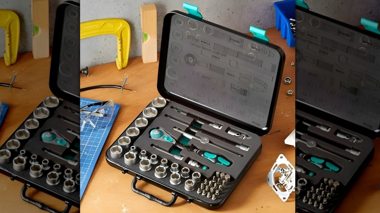 Wera Tools ratchet set open on wooden table surrounded by other tools
