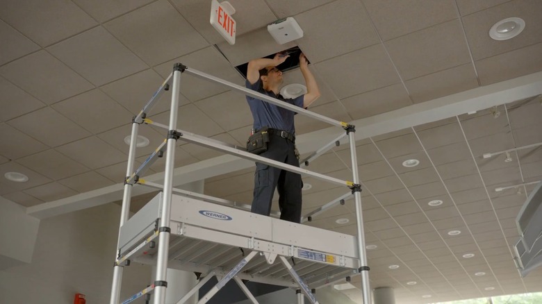 Werner scaffolding enabling a worker to access the ceiling in a commercial building