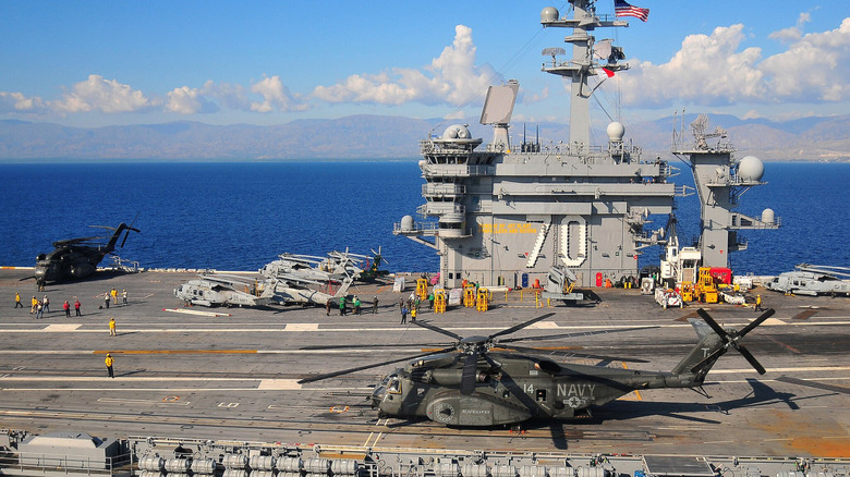 Deck of the USS Carl Vinson with helicopter and other craft