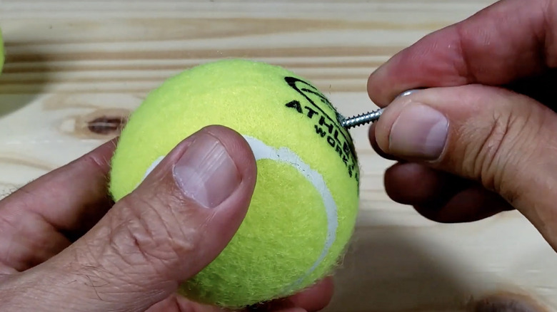 Putting hook tennis ball garage marker