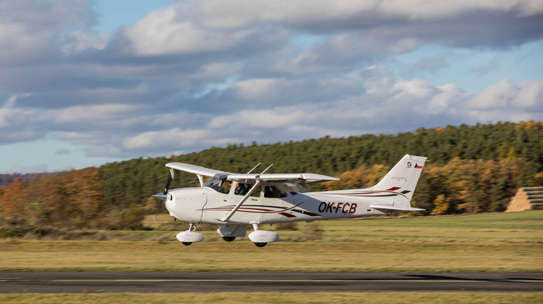 Cessna 172 on final approach at a rural airstrip