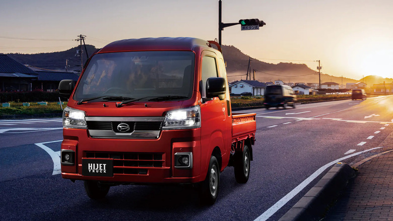 Daihatsu Hijet truck driving on road, front-left view
