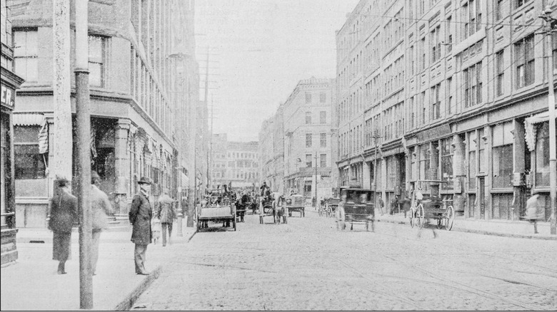 Black and white photo of Boston, Massachusetts, USA with wagons on road