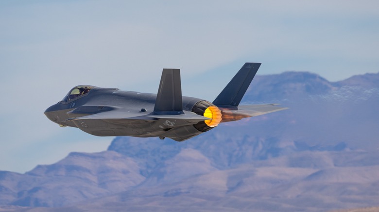 F-35 jet flying over the Nevada hills