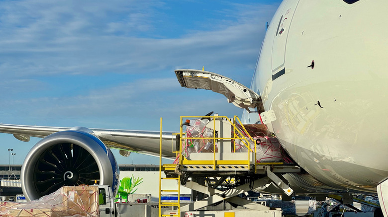 Cargo being loaded onto aircraft via aft-starboard cargo door