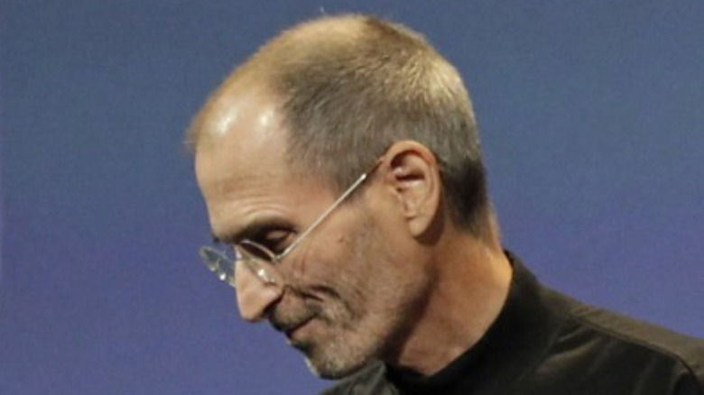 Steve Jobs looks down