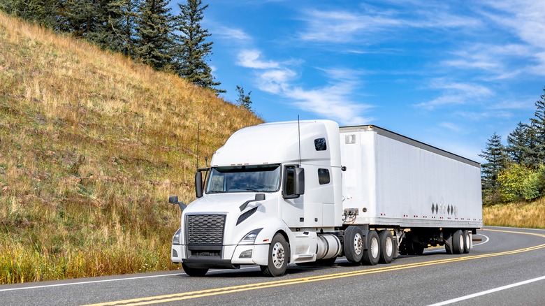 White semi-truck with white trailer