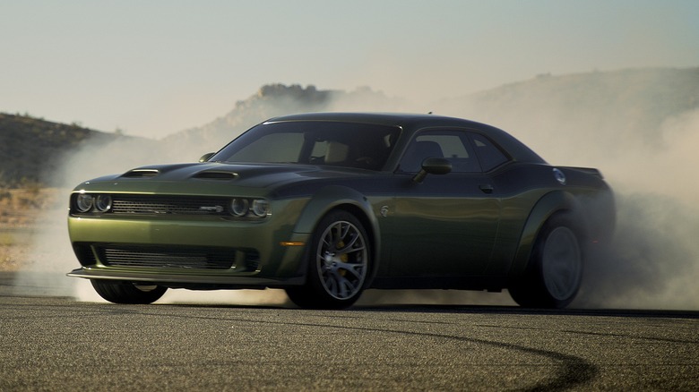 2022 Dodge Challenger kicking up smoke on the tarmac