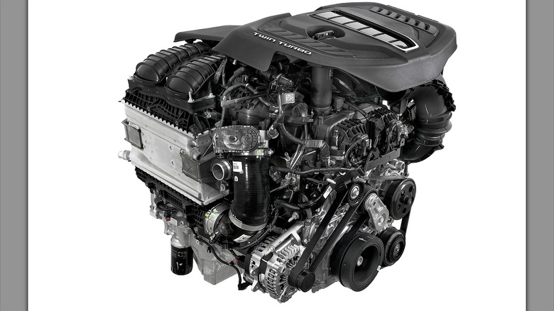 A 3.0L Twin Turbo Hurricane I6 engine on a white background