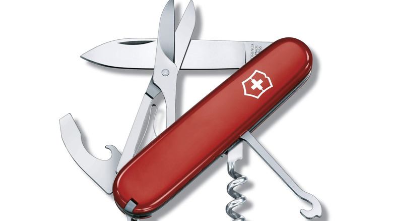 Victorinox Compact Swiss Army Knife open on white surface