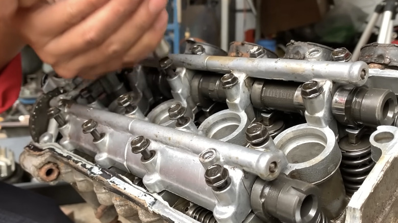 A disassembled inline four engine from a Kawasaki