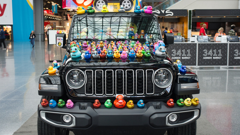 Black Jeep Wrangler covered in ducks