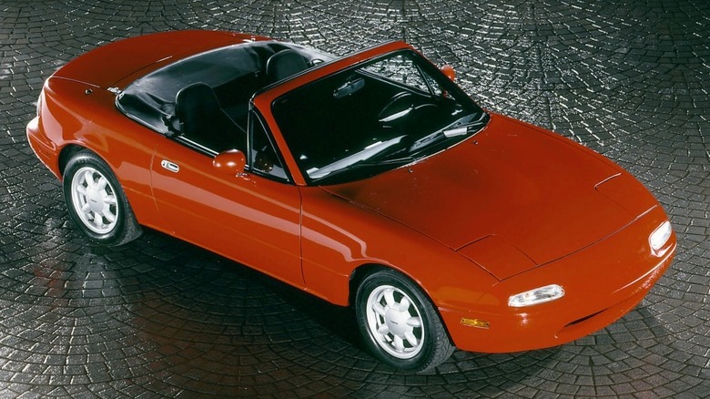 First generation Mazda Miata NA in red, front 3/4 view, high angle