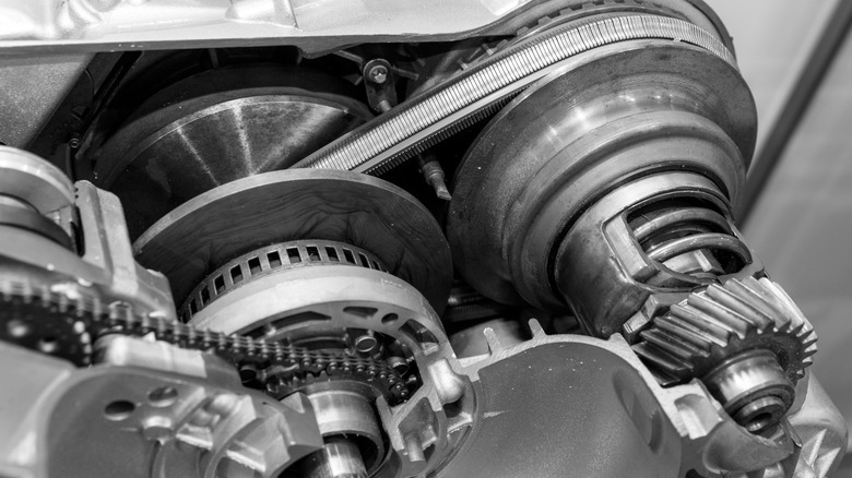A cutaway showing the inside of a CVT transmission with steel belt visible