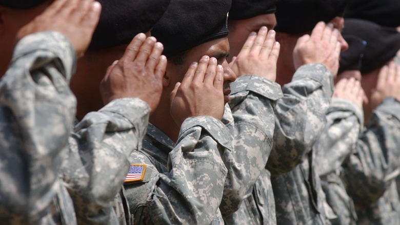 people wearing military fatigues in line