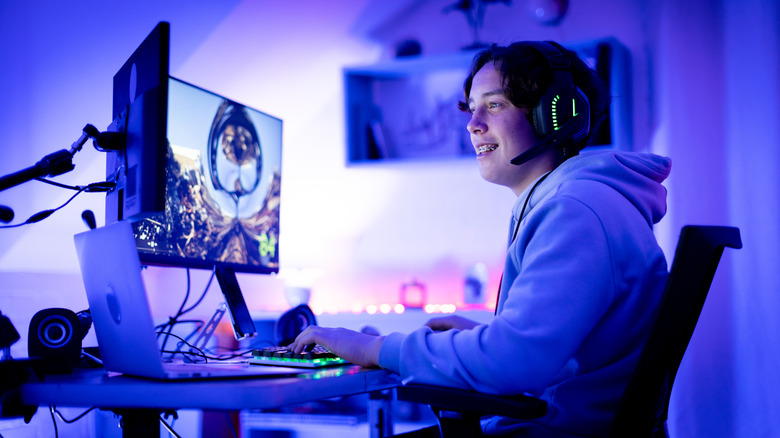 Gamer looking at dual monitors
