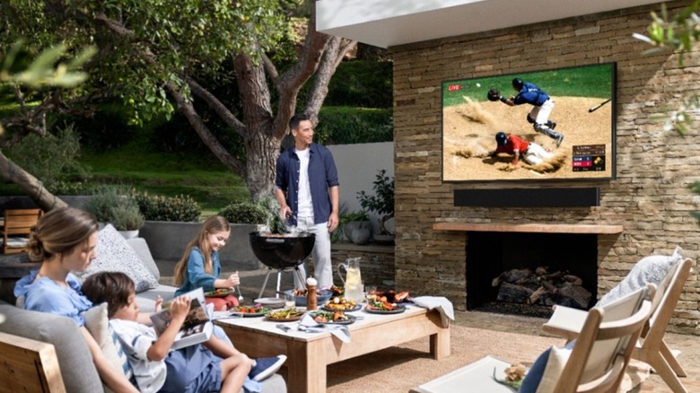 Family watching Samsung Terrace outdoor TV
