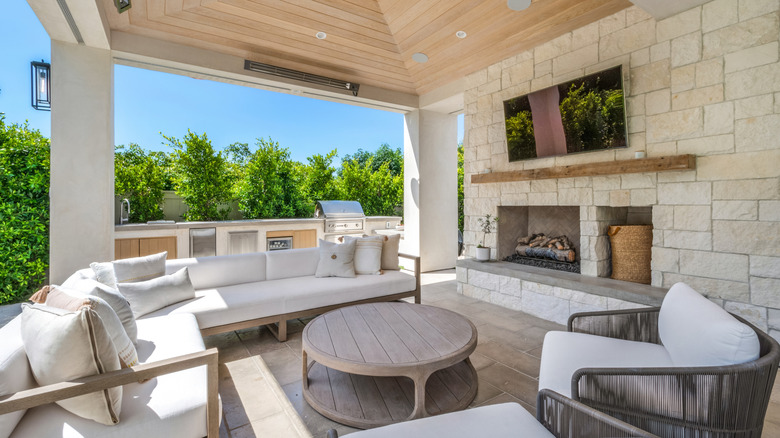 Covered outdoor living area around a TV