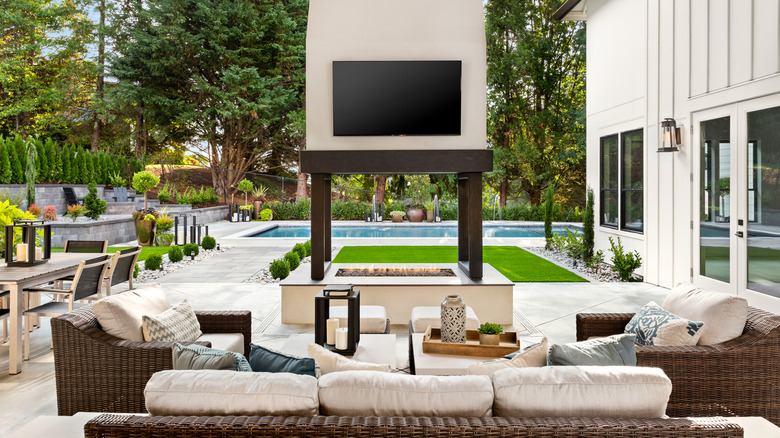 Patio furniture around an outdoor TV