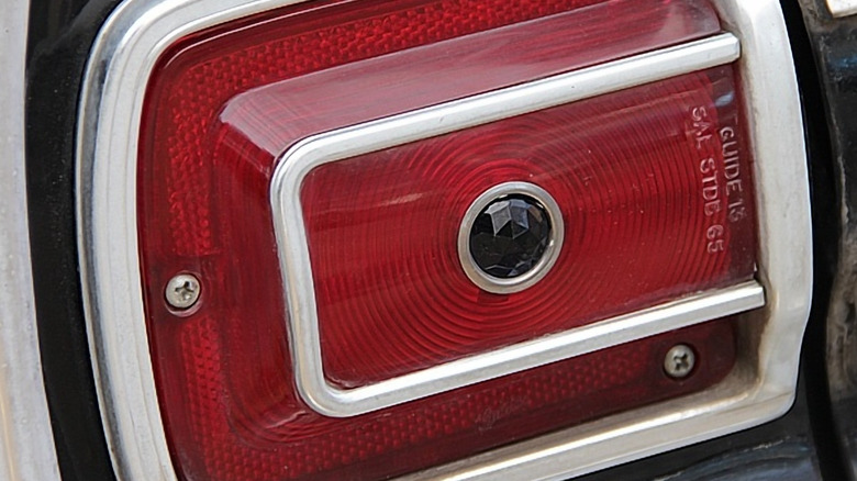 a mooneyes blue dot lens on a red tail light