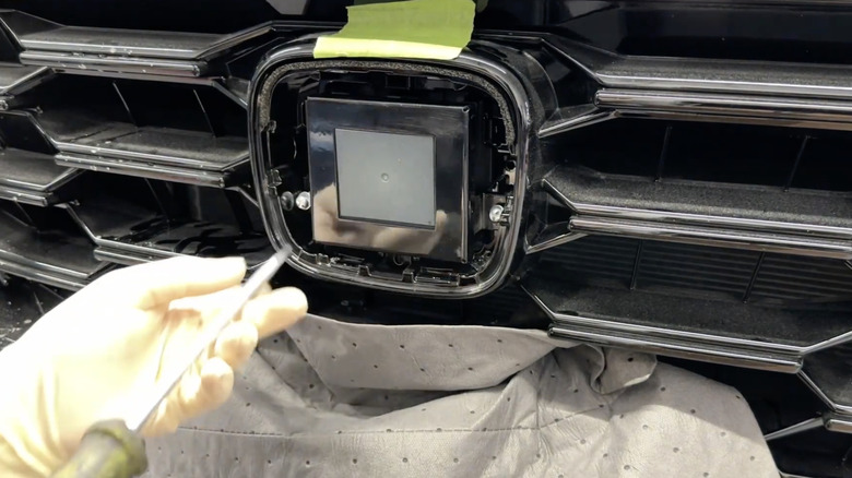 Honda radar component with protective bracket around it