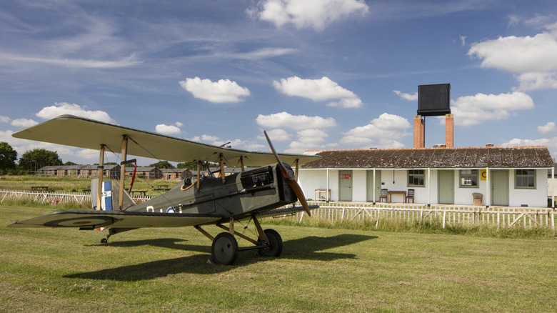 A World War I plane on farmland.