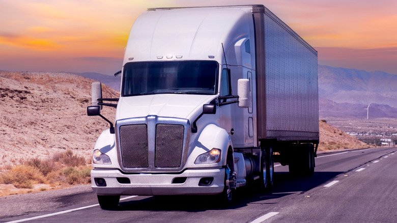 Front view of a white semi-trailer on a highway