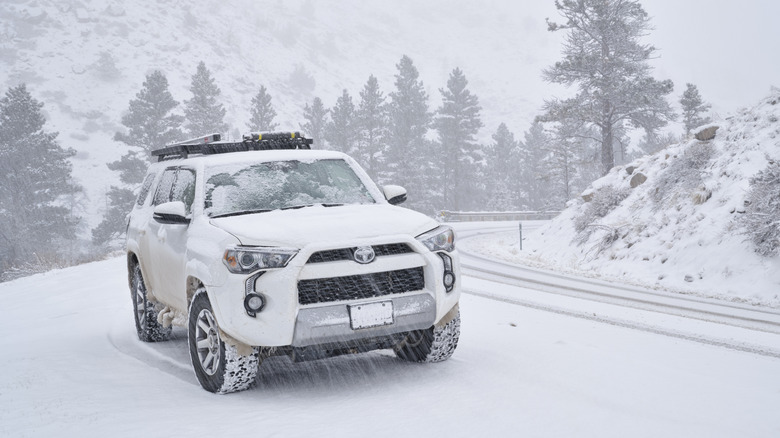 A Toyota Forerunner driving on a snow-covered road