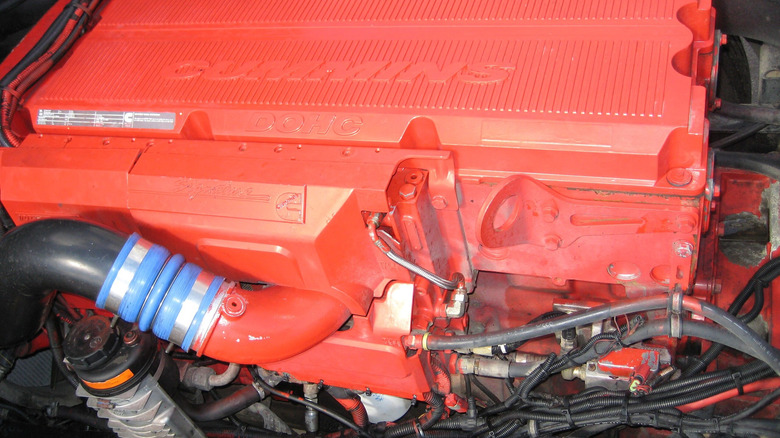 A red Cummins ISX 600 engine inside an engine bay