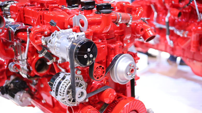 A red Cummins engine on display at an expo