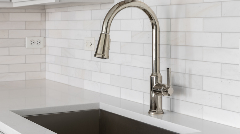 Kitchen with subway tiles and horizontal outlets