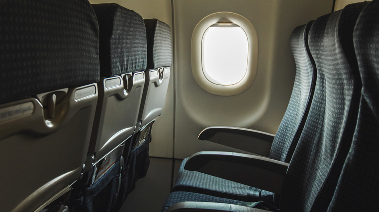 An empty row of airplane seats doesn't have a lot of legroom or access to a screen to view content