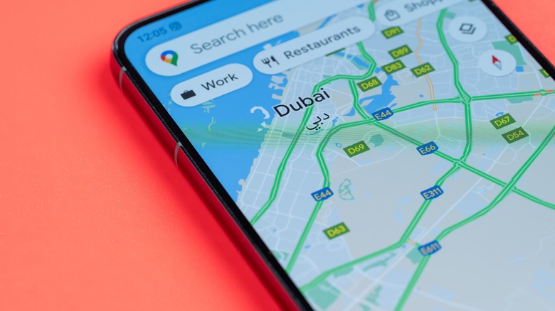 Google Maps on phone against blurred background