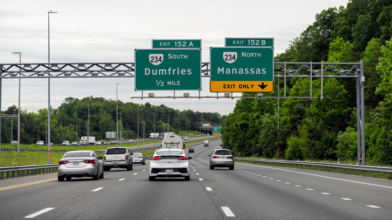Overhead highway signs for Dumfries and Manassas on Virginia State Route 234