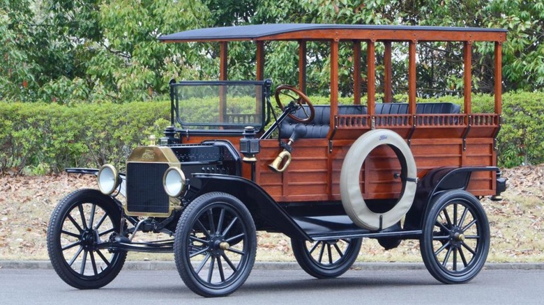 Ford Model T Depot Hack parked with trees in the background