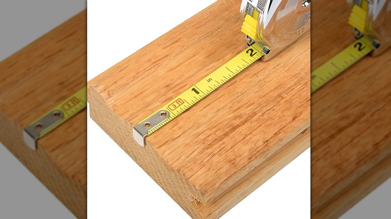Stanley PowerLock key tape measuring piece of wood